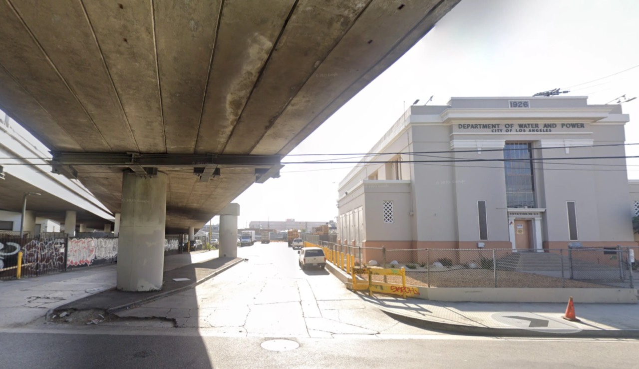 The turn off Mateo St, with the freeway overpass on the left and the Department of Water and Power building on the right